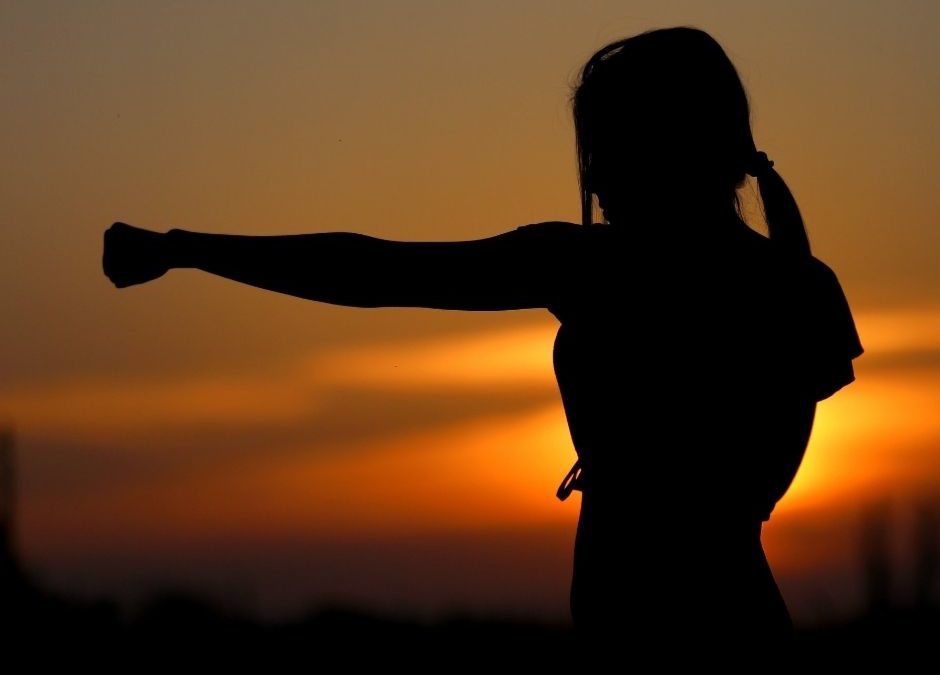 Silhouette of woman exercising